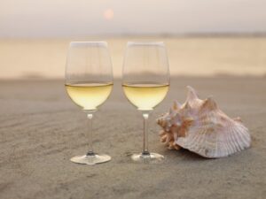 Wine Glasses and Shells on Beach