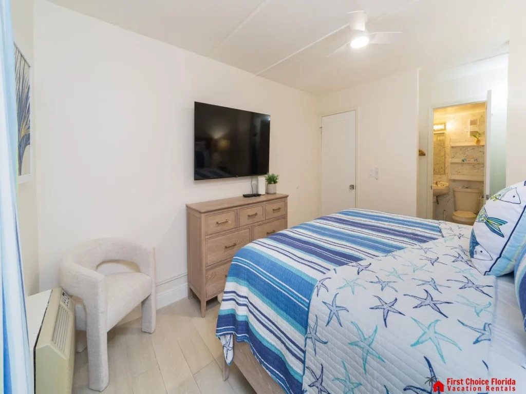 Cozy bedroom retreat with vibrant coastal decor and smart TV!