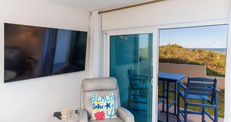 Cozy living room with scenic views of the dunes and ocean!