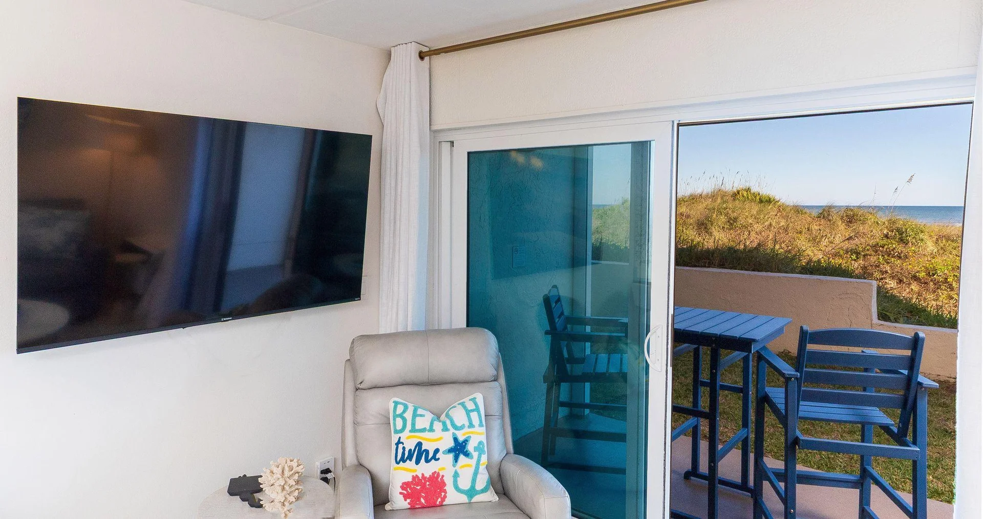 Cozy living room with scenic views of the dunes and ocean!