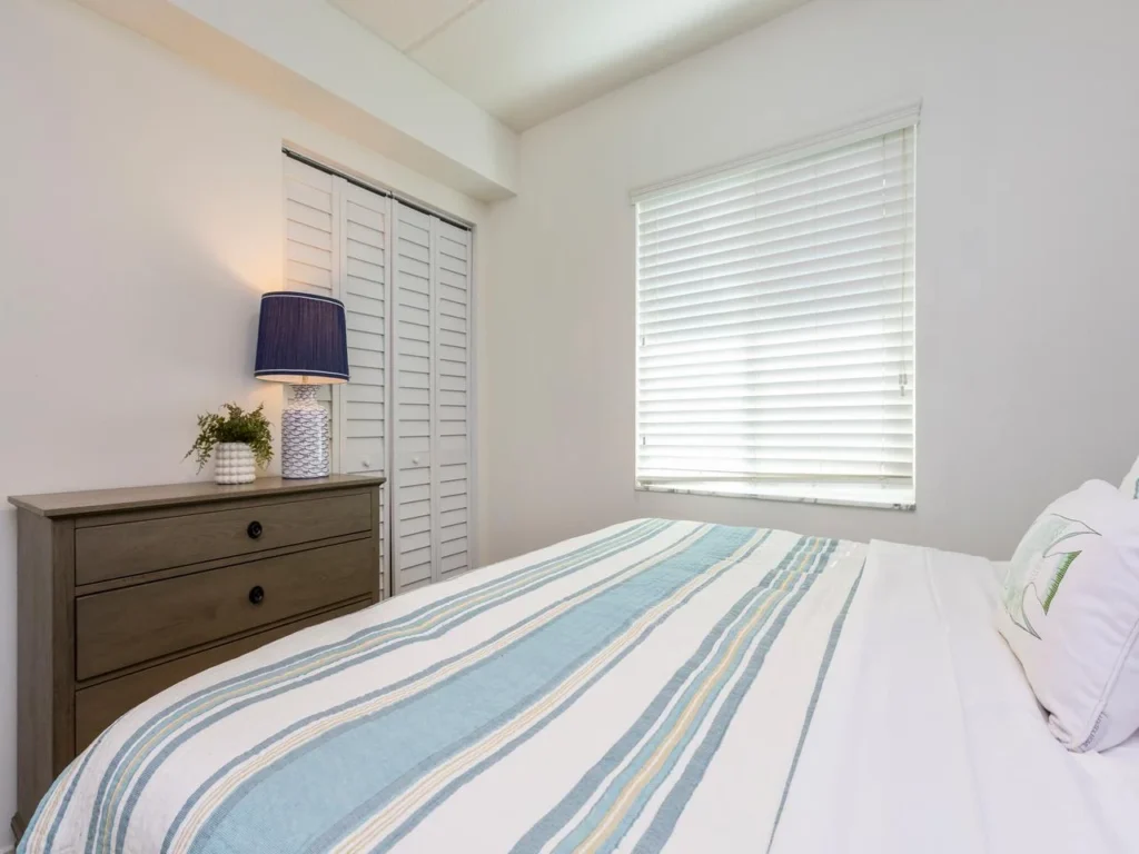 Bright and cozy guest king bedroom with calming natural light!