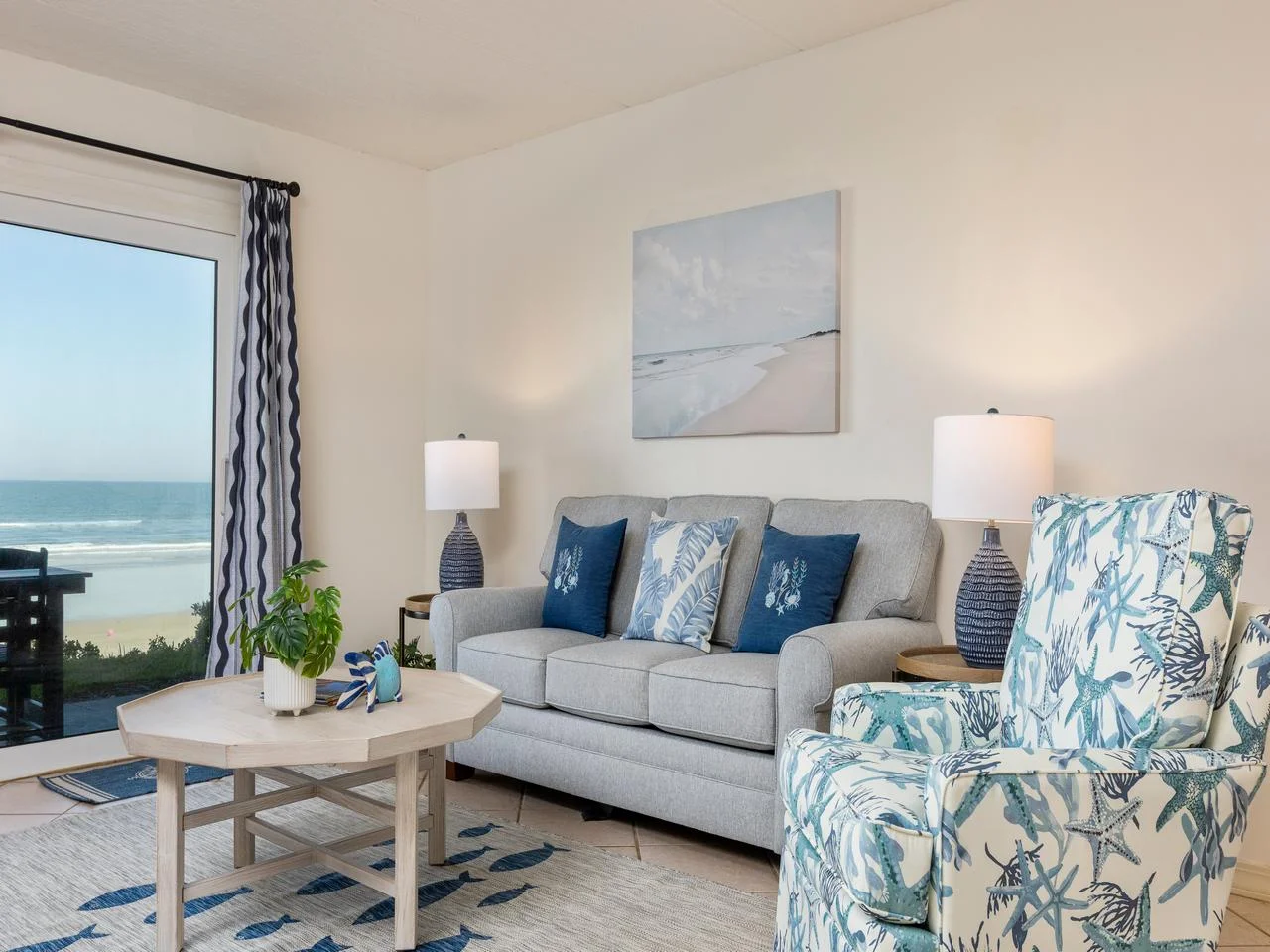Bright living room with ocean views and cozy seating!