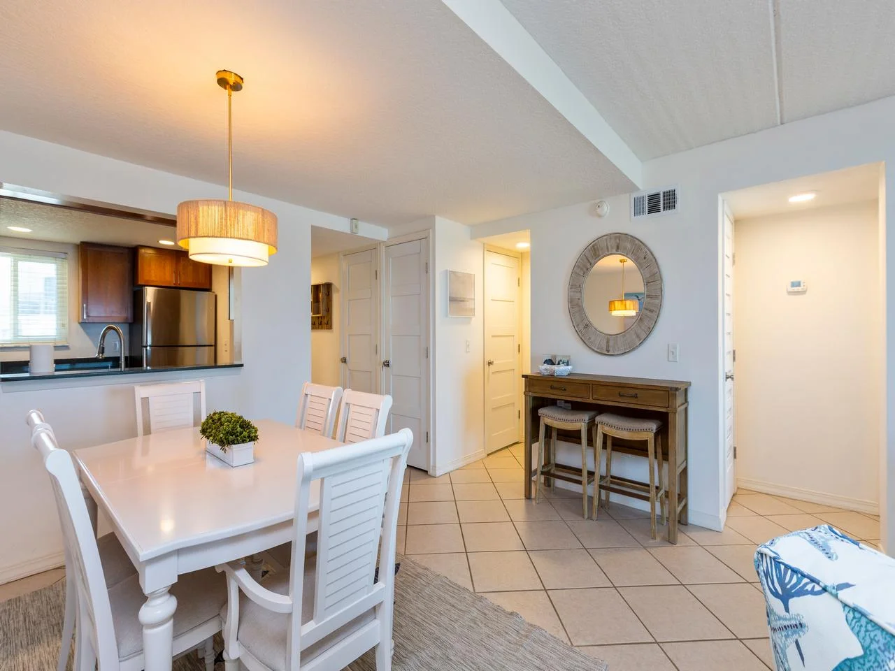 Bright dining area with cozy seating and modern kitchen access!