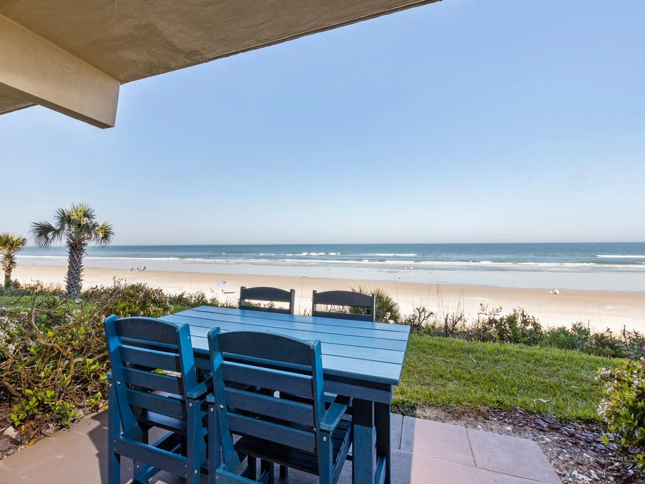 Oceanfront patio with stunning beach and sunset views!
