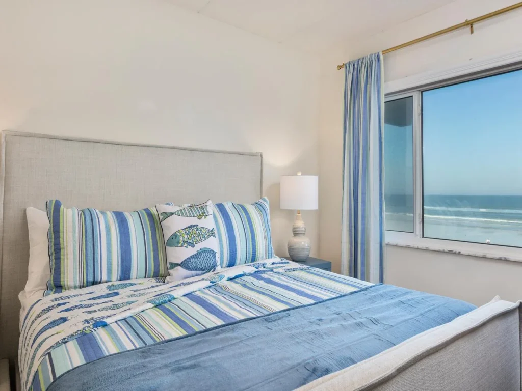 Cozy primary bedroom with stunning ocean views and natural light!