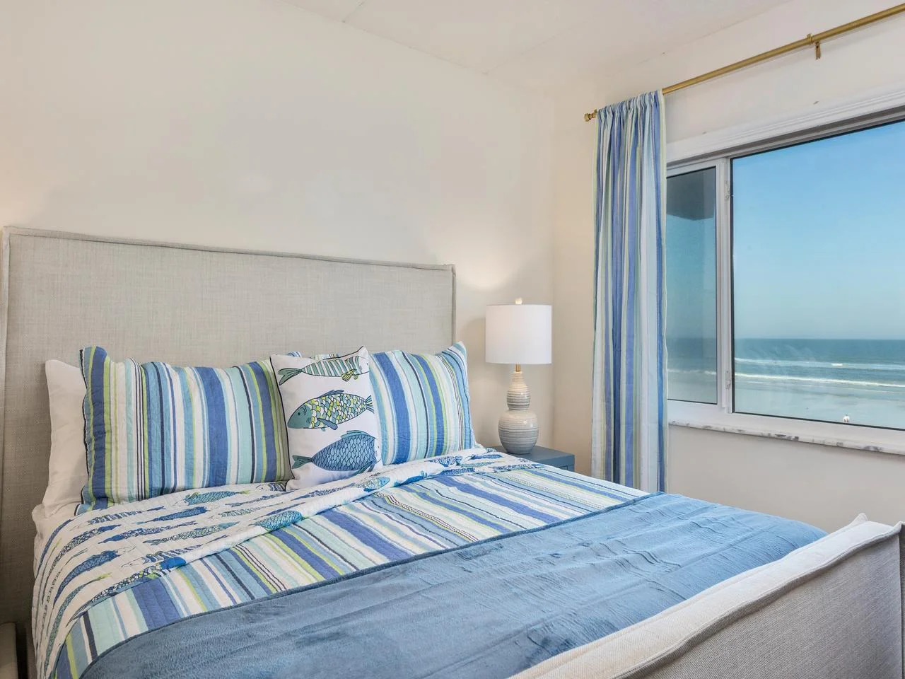 Cozy primary bedroom with stunning ocean views and natural light!
