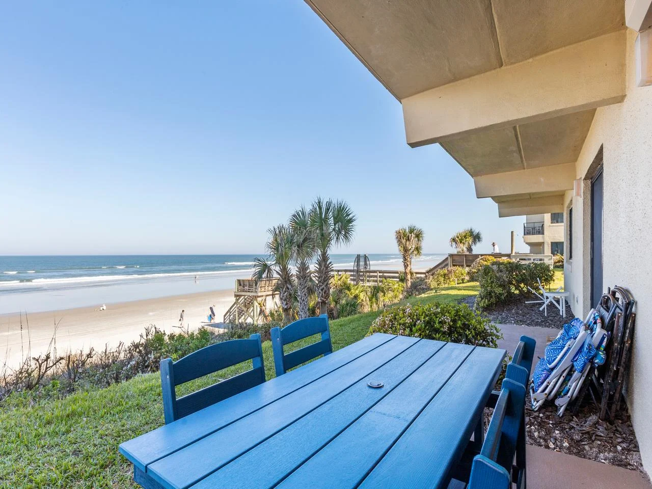 Oceanfront patio with vibrant dining and sea views!
