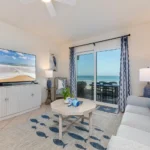 Bright living room with ocean views and cozy seating!