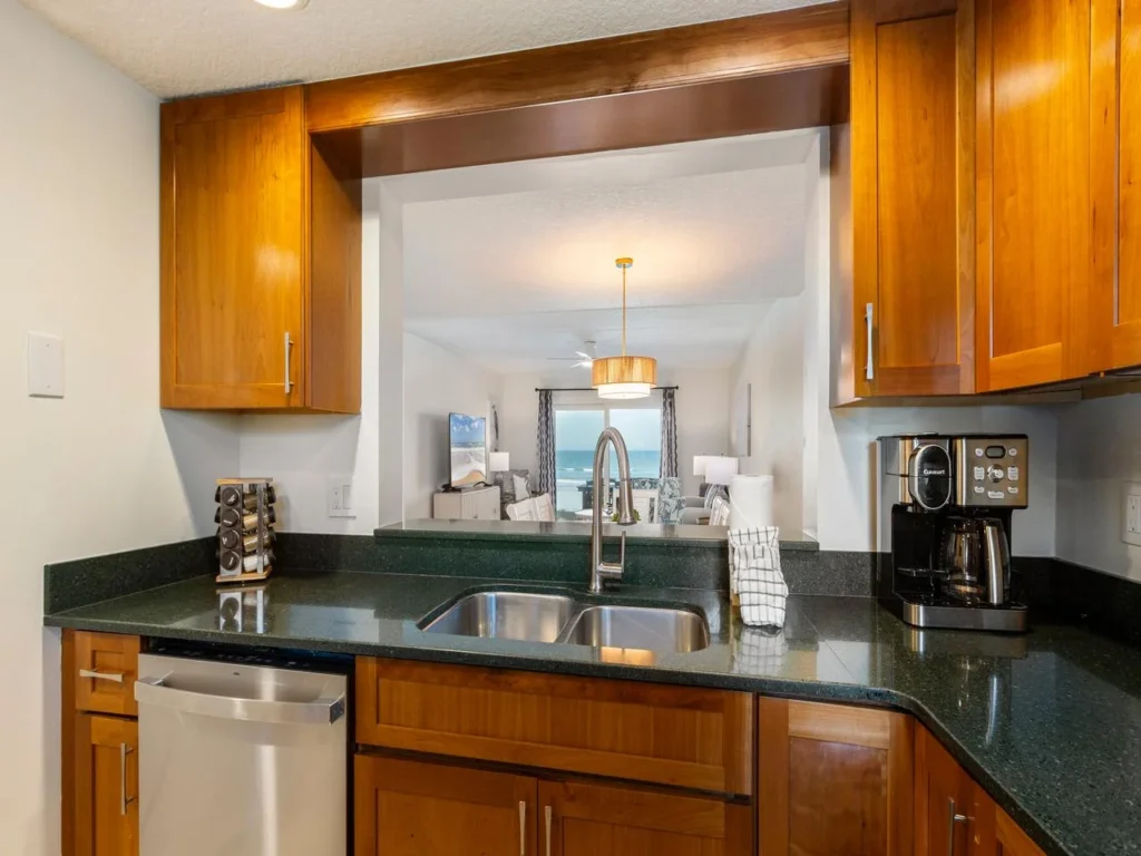 Modern kitchen with sleek countertops and warm wood cabinetry!