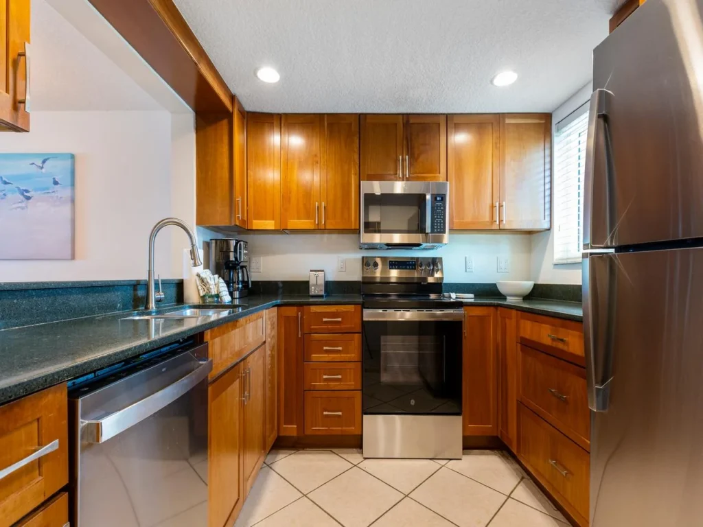 Fully equipped kitchen with modern appliances and warm wood cabinetry!