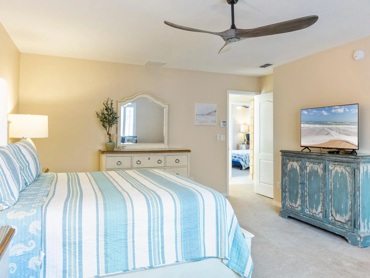 Bright and airy bedroom with coastal-inspired decor and modern comfort!