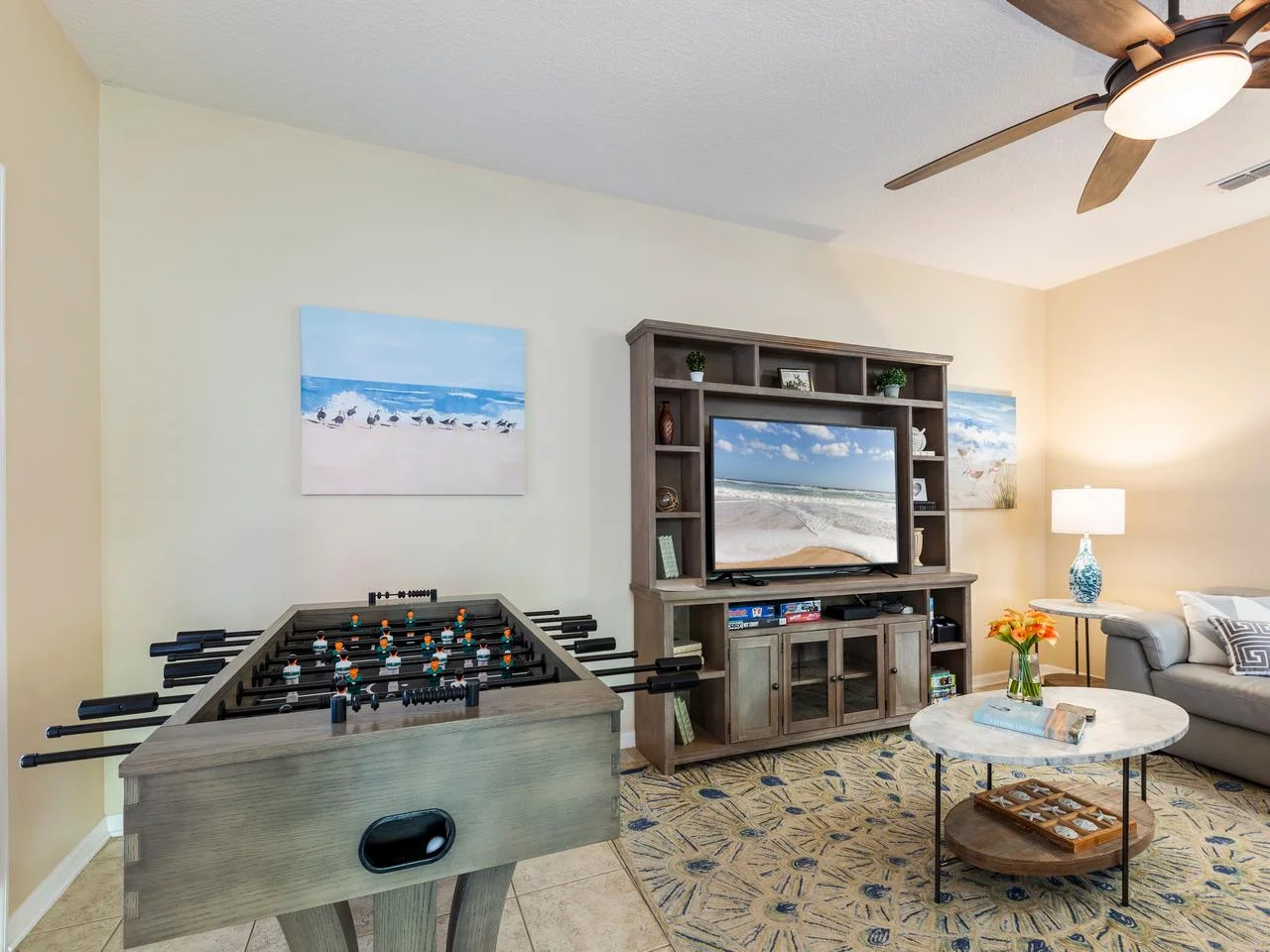 Cozy family room with entertainment center and foosball table!