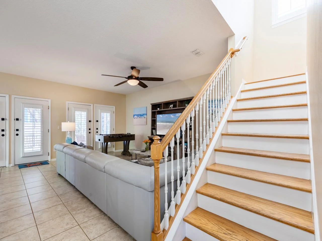 Spacious family room with cozy seating and natural light!