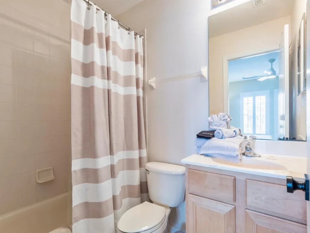 Bright and clean guest bathroom with fresh linens and natural light!