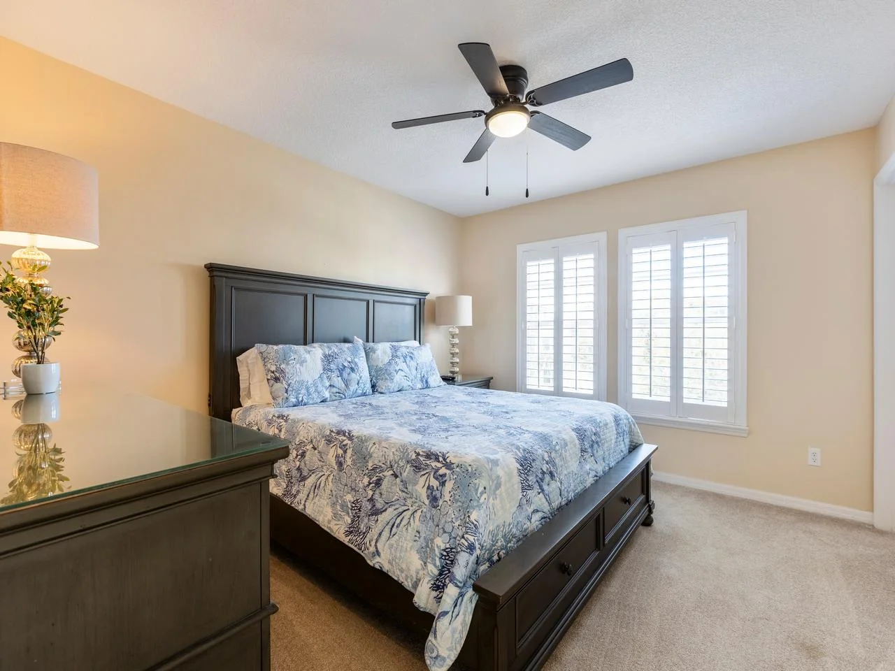 Sunlit guest king bedroom retreat with elegant furnishings and ensuite bathroom!