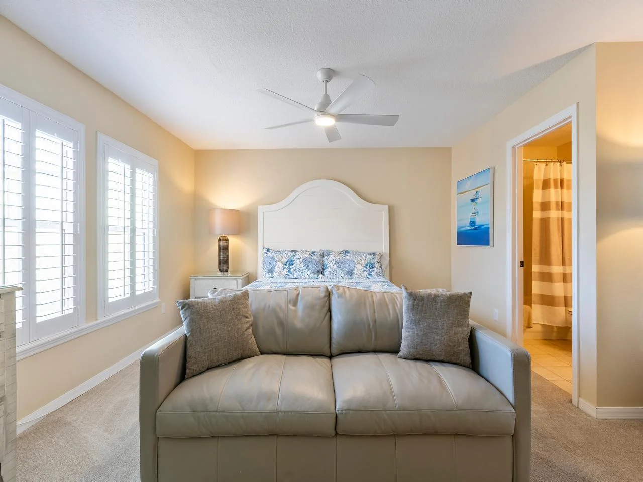 Bright and airy bedroom with queen sofa sleeper and natural light!