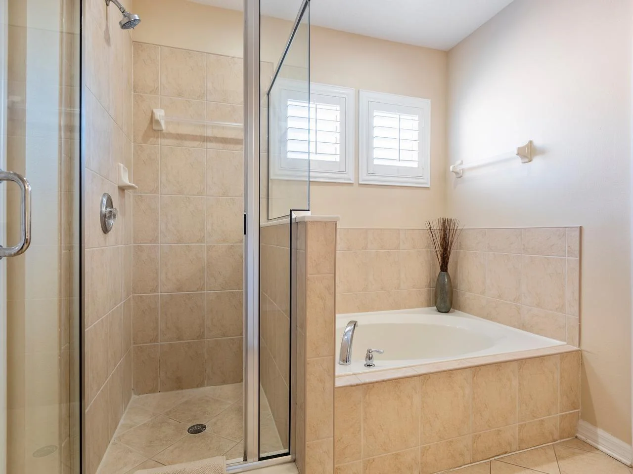 Spa-like bathroom with separate glass shower and soaking tub!