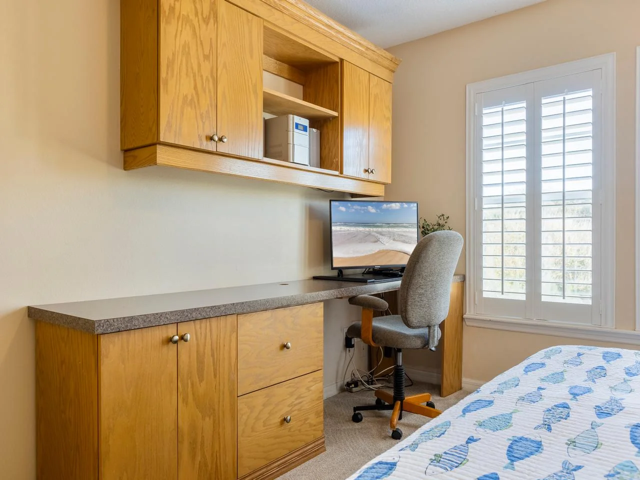 Cozy bedroom nook with built-in desk and natural light