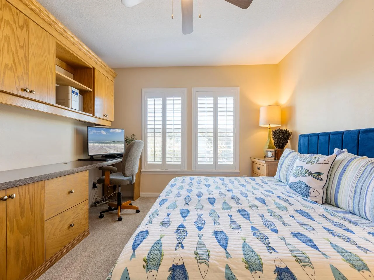 Cozy bedroom with built-in desk and natural light!