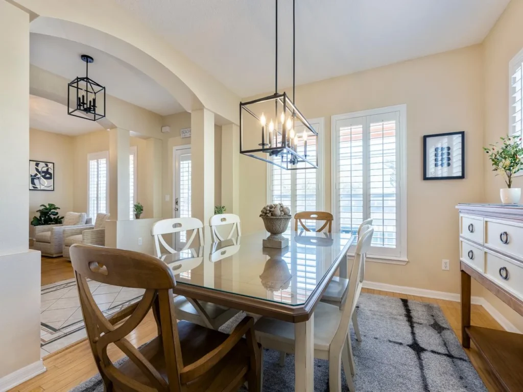 Sunlit dining room with elegant glass table and cozy seating for 6!