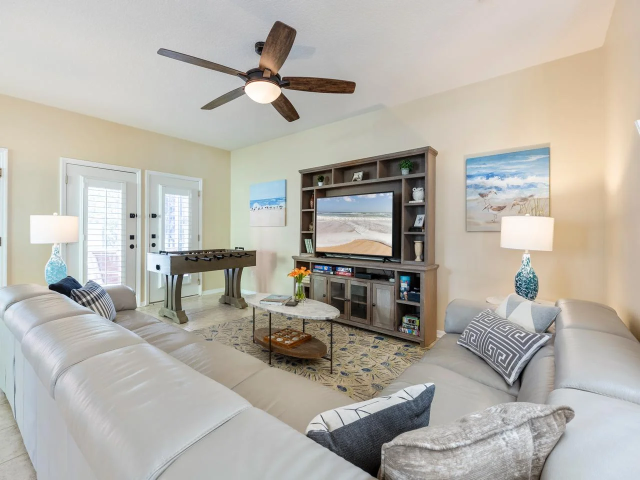 Spacious family room with cozy seating and game table fun