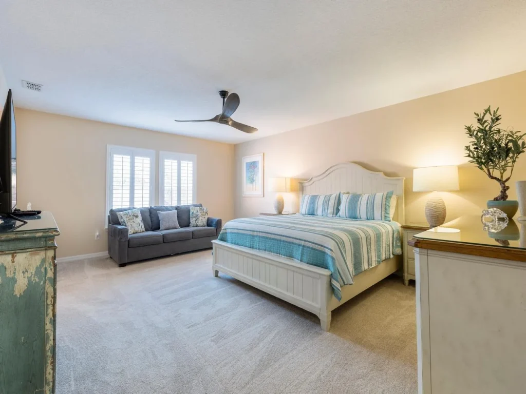Spacious primary bedroom with sofa sleeper and natural light!