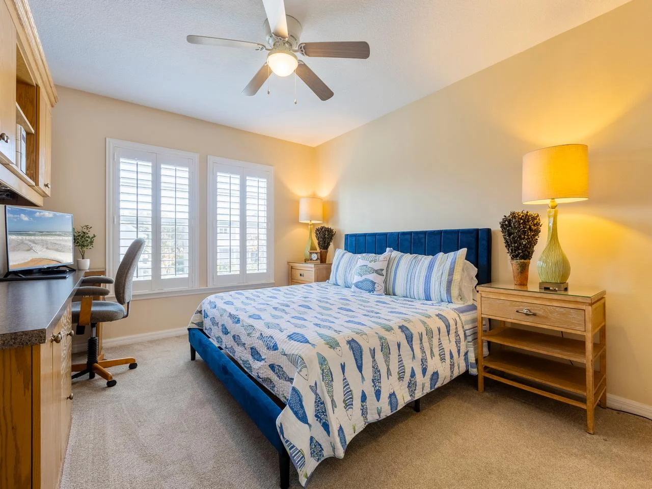 Bright and cozy guest king bedroom with workspace and natural light!