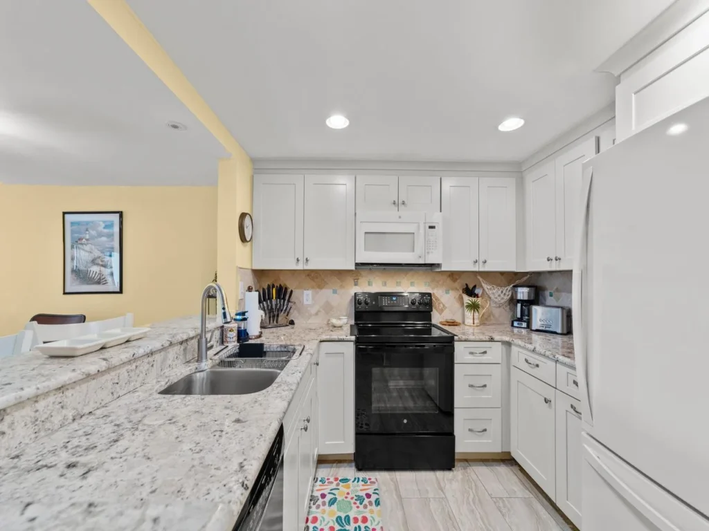 Bright, modern kitchen with granite countertops and ample storage