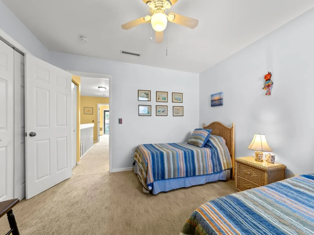 Cozy twin bedroom with soft lighting and peaceful decor