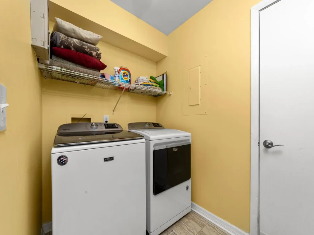 Bright laundry room with modern washer and dryer amenities