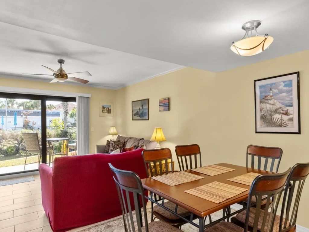 Bright and airy living and dining area with waterfront views