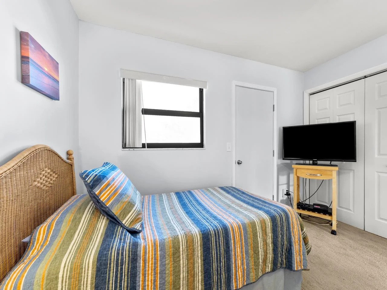 Cozy bedroom with vibrant linens and natural light
