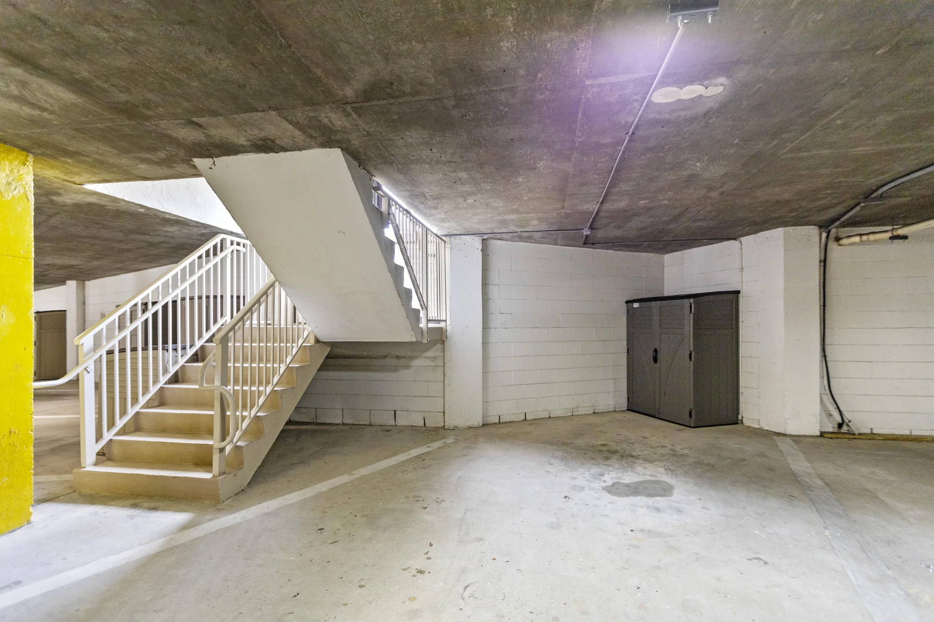 Spacious, secure garage with one assigned spot and easy stair access to your retreat