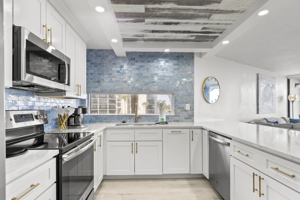 Bright, modern kitchen with microwave dishwasher and stylish backsplash