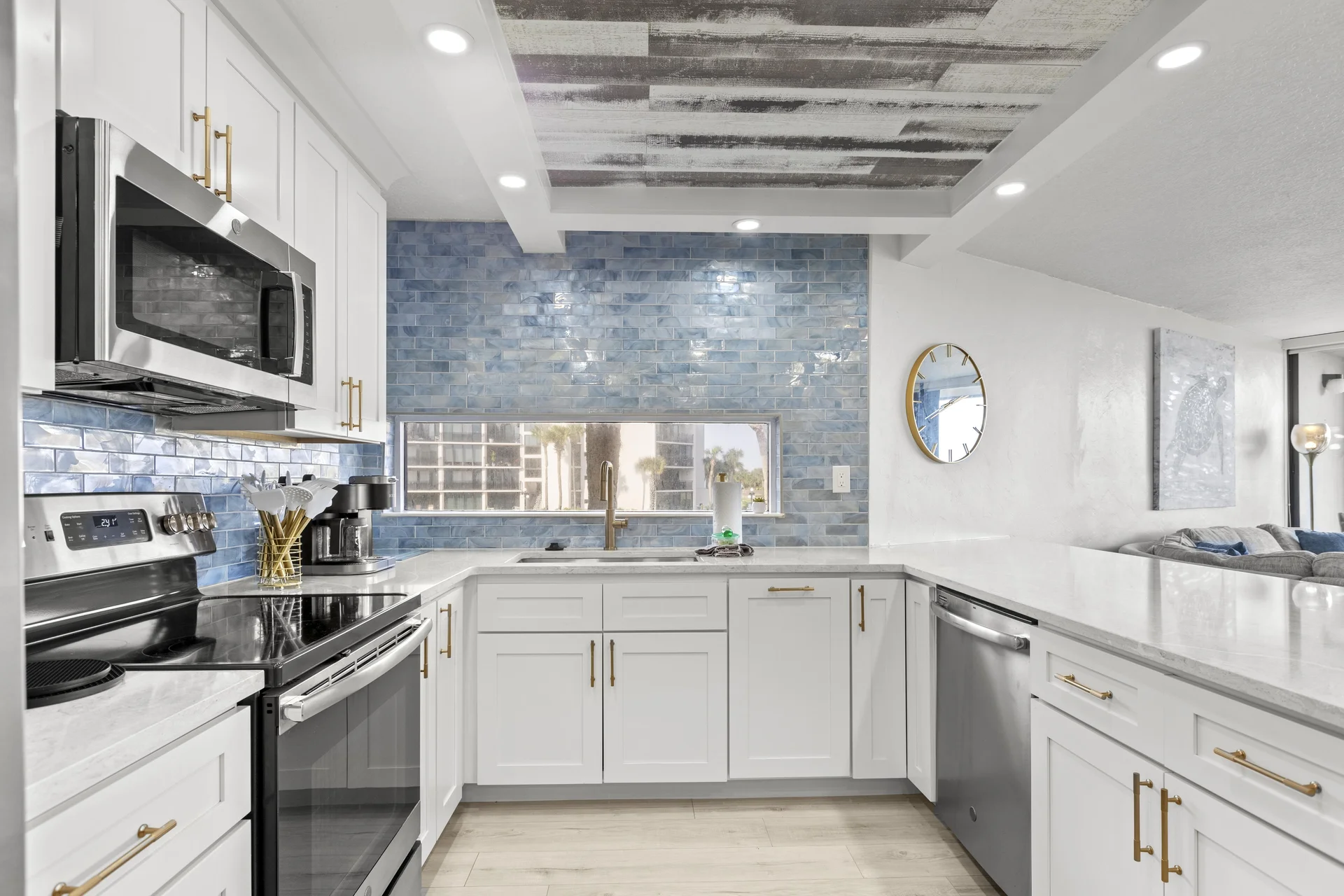 Bright, modern kitchen with microwave dishwasher and stylish backsplash