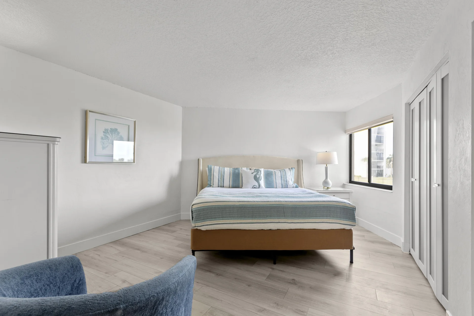 Bright and airy bedroom with cozy king-size bed and natural light