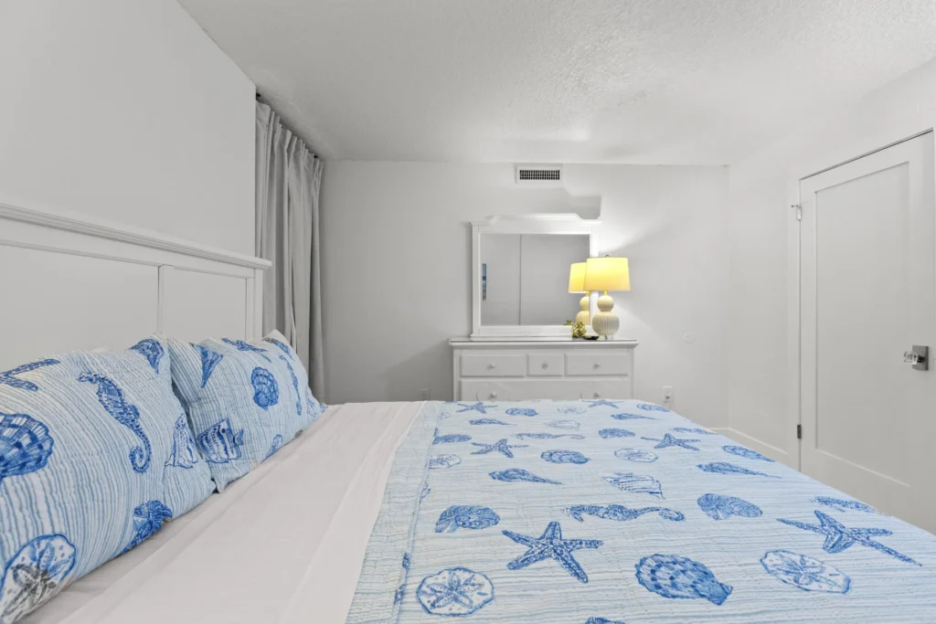 Third bedroom retreat with king bed and soft lighting