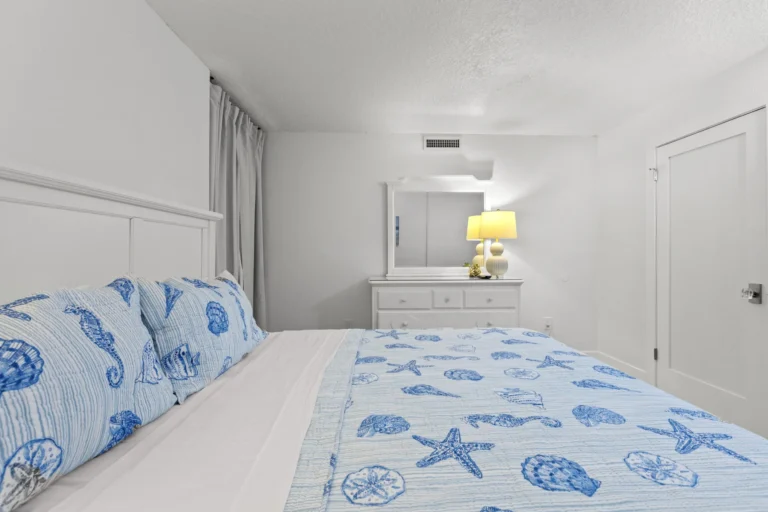Third bedroom retreat with king bed and soft lighting