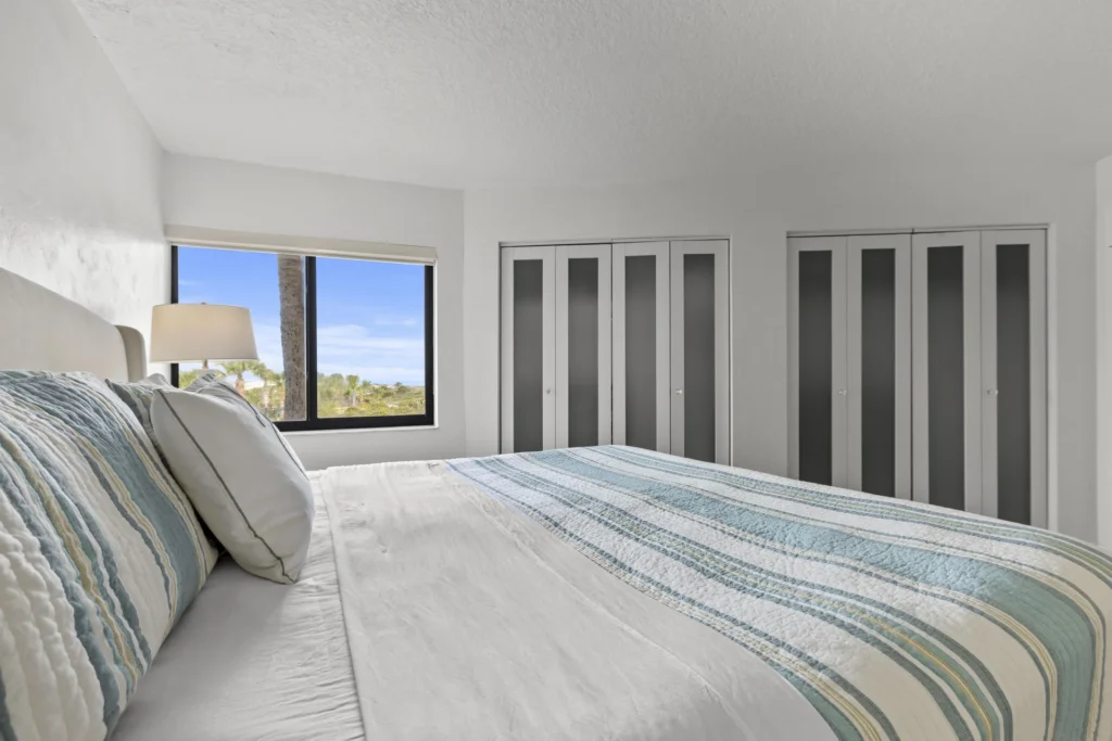 Second bedroom bight and airy with scenic ocean views and king bed