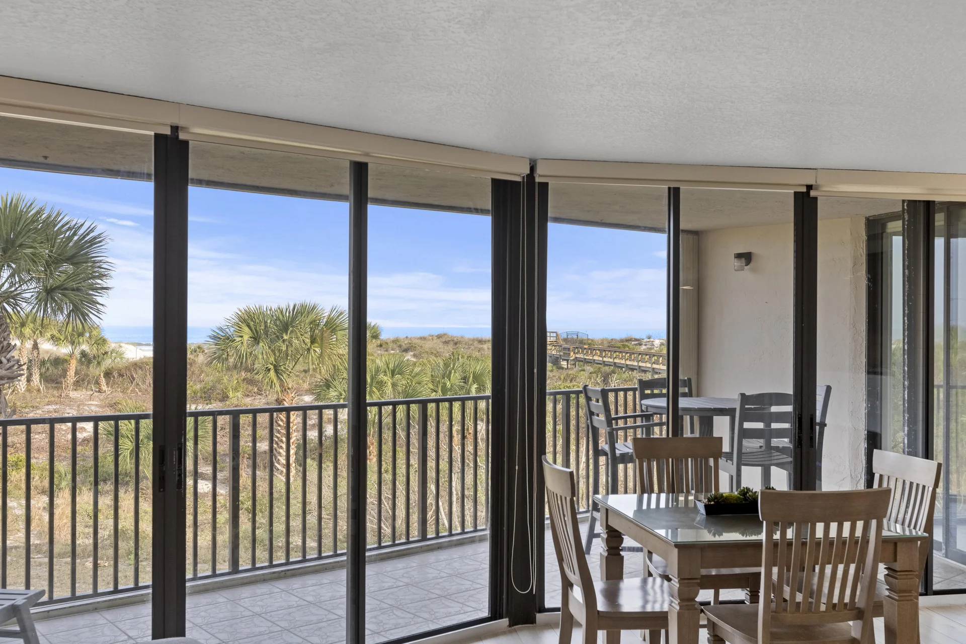Spacious oceanfront balcany with scenic views and dining area