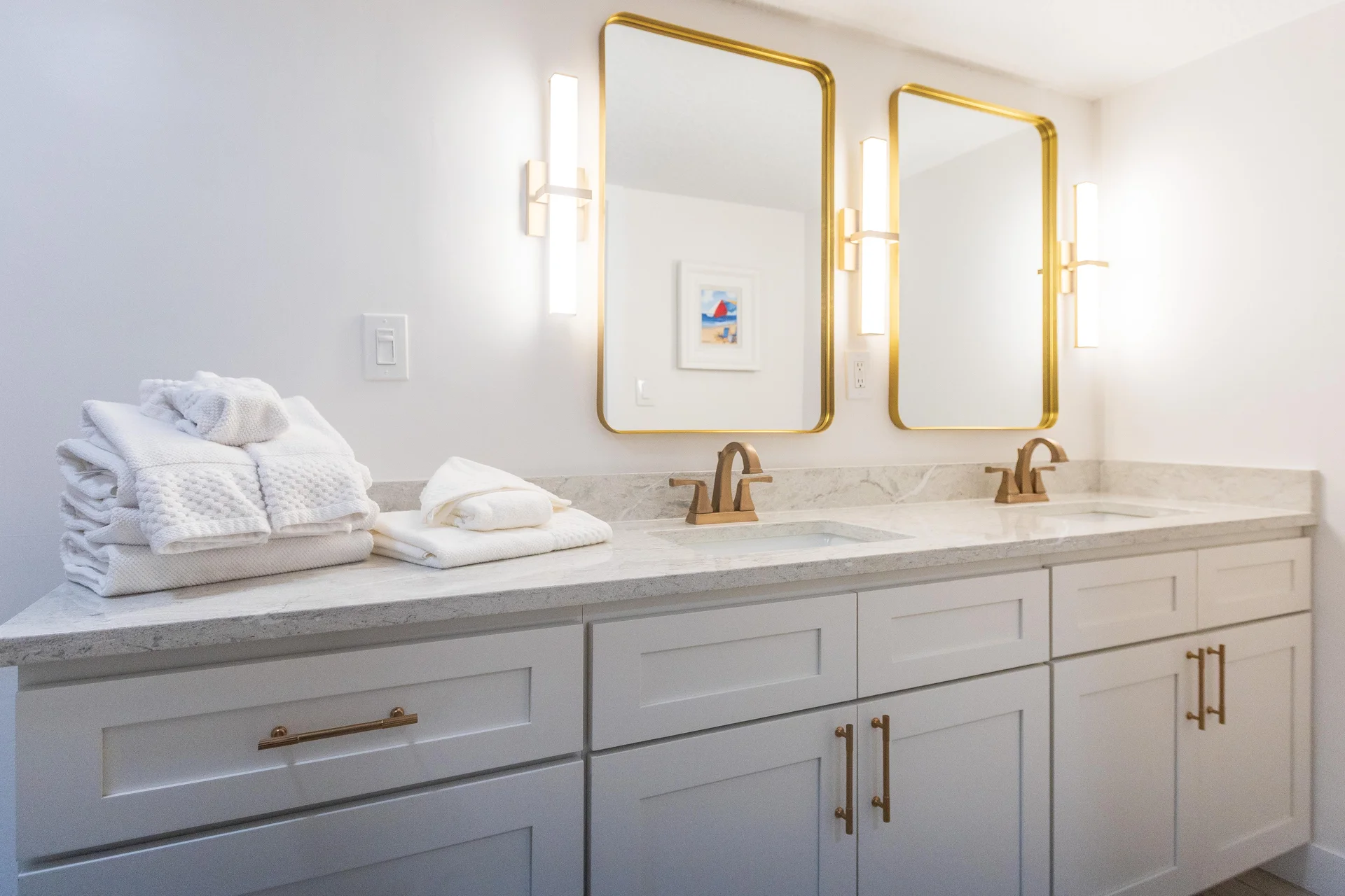 Ensuite, primary bathroom with dual vanities and elegant fixtures