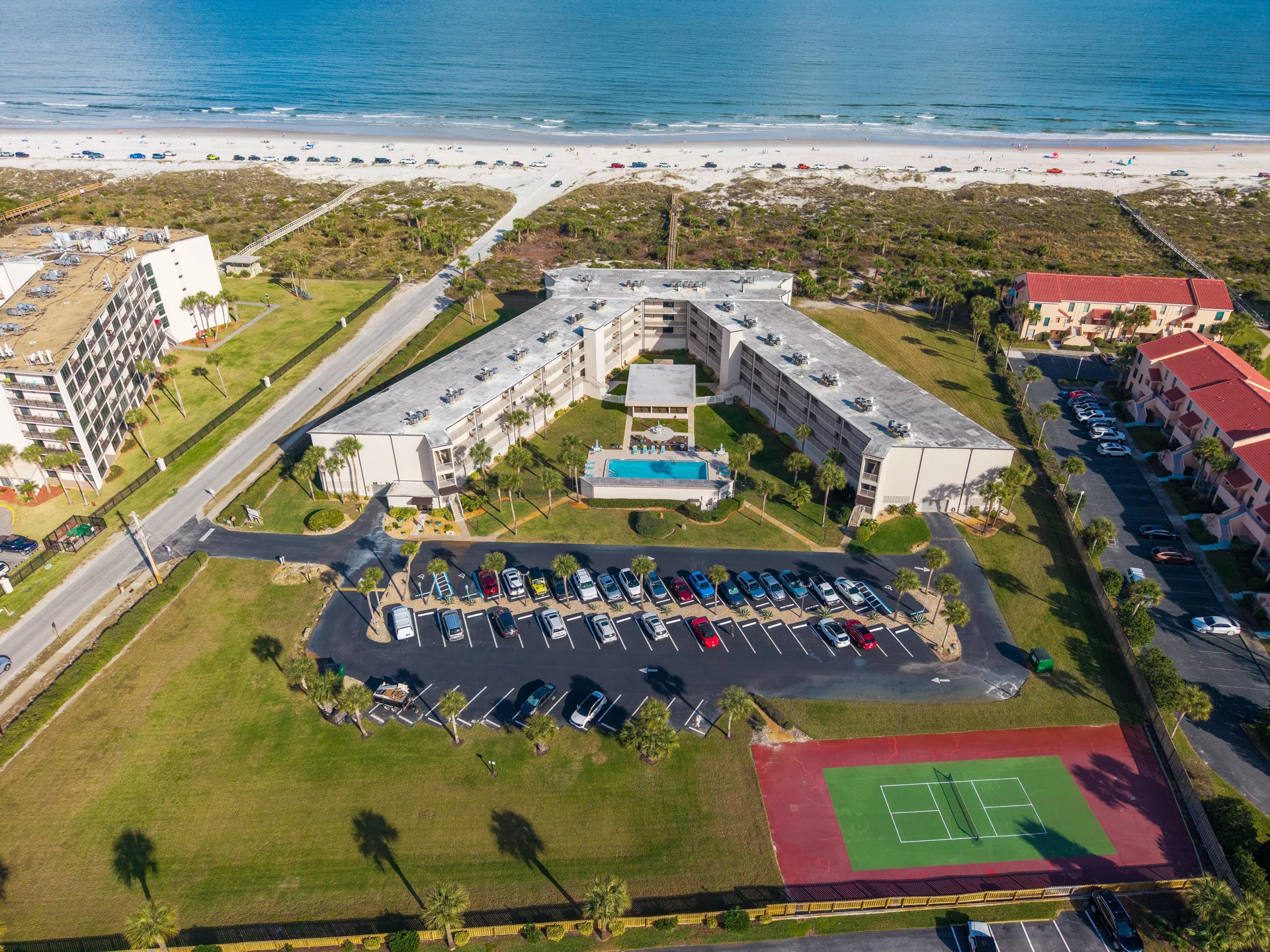 Oceanfront condo with pool, tennis court, and beach access