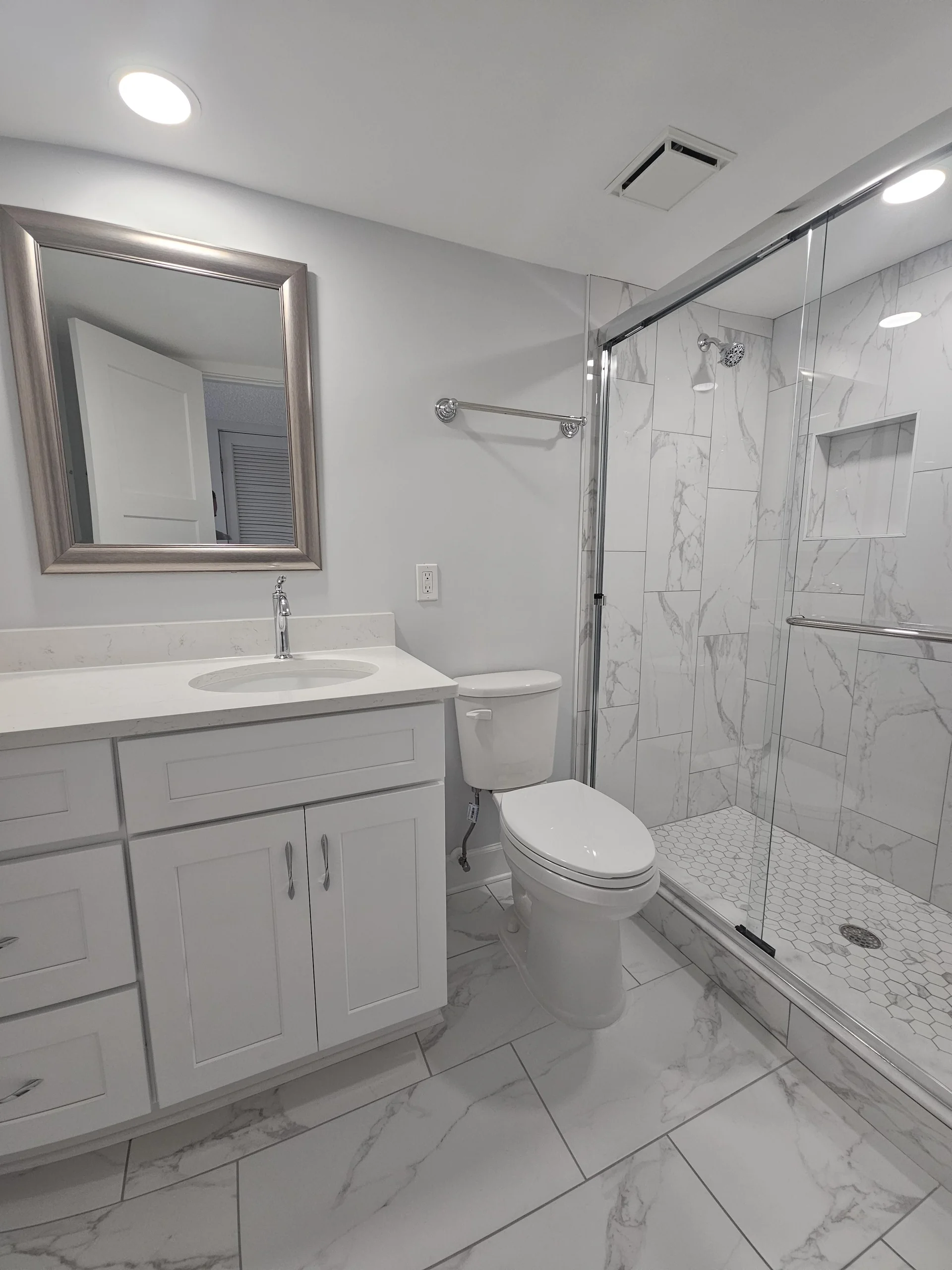 Modern guest bathroom with sleek glass shower