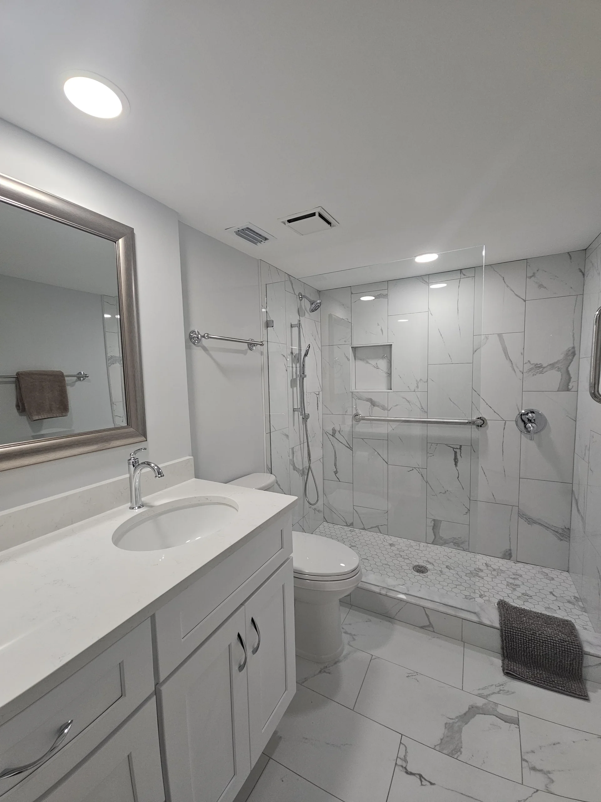 Bright, modern primary bathroom with a spacious shower