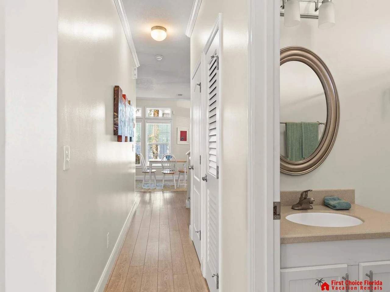 Bright hallway leading to cozy living and dining areas