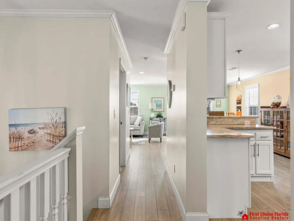 Bright, airy hallway leading to cozy living and kitchen areas