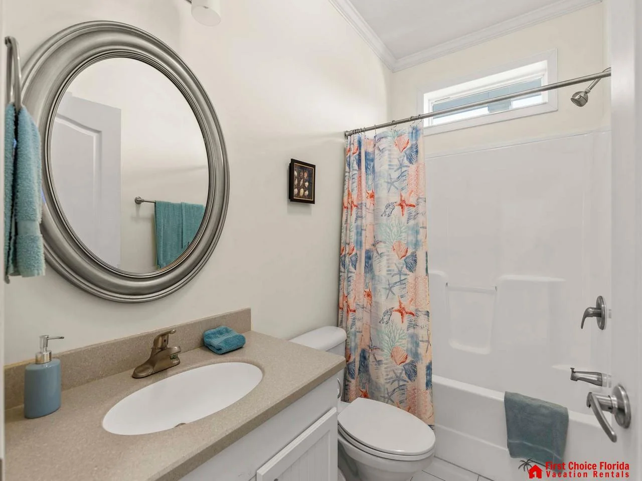 Bright and cheerful bathroom with colorful shower curtain