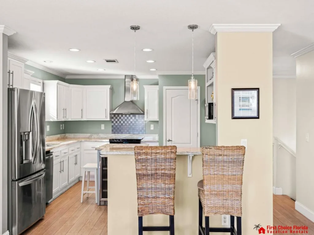 Modern kitchen with sleek appliances and cozy breakfast bar seating