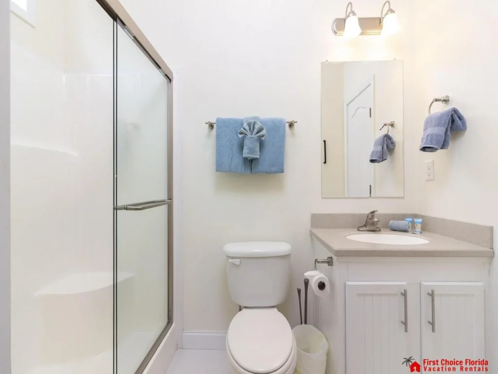 Bright, clean bathroom with modern shower and fresh towels