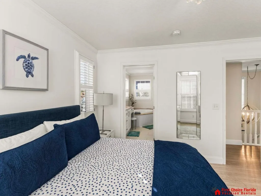 Bright and airy bedroom with cozy navy accents
